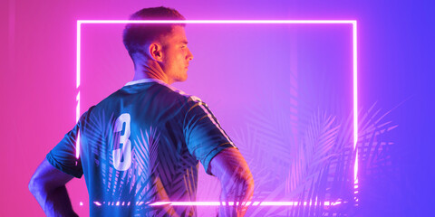 Wall Mural - Rear view of caucasian male player wearing number 3 jersey over illuminated rectangle and plants