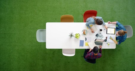 Poster - Top view, team creative and brainstorming ideas for group project in office at work desk. Teamwork, planning and have conversation for startup company strategy at table in workplace or workspace.
