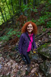 © Xalanx - Hiker lady with camera in the mountain forest
