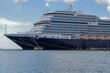 Huge modern HAL cruiseship or cruise ship liner Koningsdam in port during Caribbean cruising dream vacation	tropical island scenery