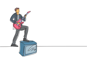 Poster - Single continuous line drawing of young happy male guitarist playing electric guitar while step on sound amplifier. Trendy musician artist performance concept one line draw design vector illustration