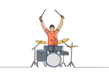 Poster - One single line drawing of young happy male drummer raise drumstick up while play drum set on music concert stage. Musician artist performance concept continuous line draw design vector illustration