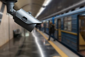 Wall Mural - CCTV Camera security operating on subway station platform.underground railways station