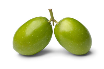 Pair of fresh raw green olives close up isolated on white background