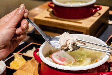 Wall Mural - woman eating hot pot