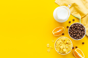 Wall Mural - Healthy corn flakes with fruits for breakfast, top view