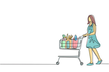 Poster - One continuous line drawing young happy female pushing trolley with fruits, bread, milk, vegetables and milk inside. Monthly shopping in supermarket concept. Single line draw design illustration
