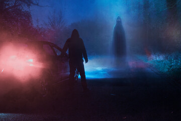 Wall Mural - A supernatural concept of a spooky ghost floating above a road. With a driver next to car in a scary foggy winters forest at night
