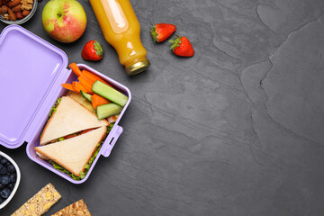 Wall Mural - Flat lay composition with lunch box and tasty healthy food on grey table., space for text. School dinner