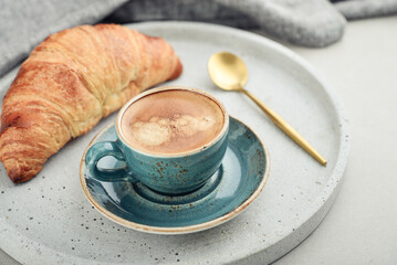 Wall Mural - Croissant and a cup of coffee