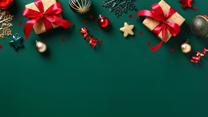 Wall Mural - Christmas frame top border. Christmas decorations, gift boxes, Xmas baubles on dark green background. Flat lay. Top view.