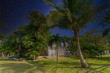 Playacar Mayan ruins in the forest park with Milky Way Galaxy stars night sky in Playa del Carmen, Yucatan, Mexico