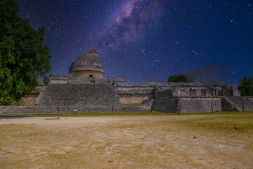 Ruins of El Caracol observatory temple, Chichen Itza, Yucatan, Mexico, Maya civilization with Milky Way Galaxy stars night sky