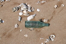 Blue Glass Bottle On Beach