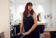 © K Abrahams/peopleimages.com - Salon, small business and happy hairdresser preparing or getting ready for work at her station. Happiness, smile and proud hairstylist or beautician with beauty hair care startup company in Australia