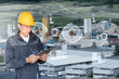 © scharfsinn86 - Engineer with digital tablet on a background of modern smart factory. Digital transformation and industry 4.0