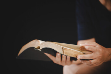 Young woman person hand holding holy bible with study at home. Adult female christian reading book in church. Girl learning religion spirituality with pray to god. concept of student education faith.