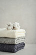 Stack of bath towels with cotton flowers