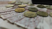 Close Up Shot Of Hong Kong Dollar Banknotes And Coins On Blurred Background