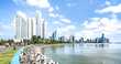 Panorama view of modern skyline at Panama City waterfront - International metropolis concept with highrise buildings and beach boardwalk at central america capital place - Bright vivid sunny filter