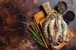 Whole Black tiger giant prawns shrimps in a skillet. Raw Seafood. Dark background. Top view. Free copy space