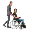 © Kruwt - Man pushing woman in a wheelchair isolated on transparent background