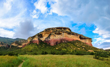 Grassy Plains Below Mushroom Rock, A Colorful Sandstone Outcrop In The Golden Gate Highlands National Park. This Is A Nature Reserve Near The Popular Town Of Clarens In The Free State, South Africa.