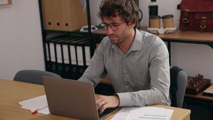 Poster - Young hispanic man business worker stressed using laptop at office