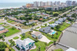 Aerial of Daytona Beach Shores residential neighborhood  in the foreground with high rise condos and hotels in the background.