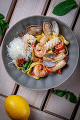 Canvas Print - Pasta with fresh seafood, shrimp, red pepper, oysters, scallops, squid and tomato