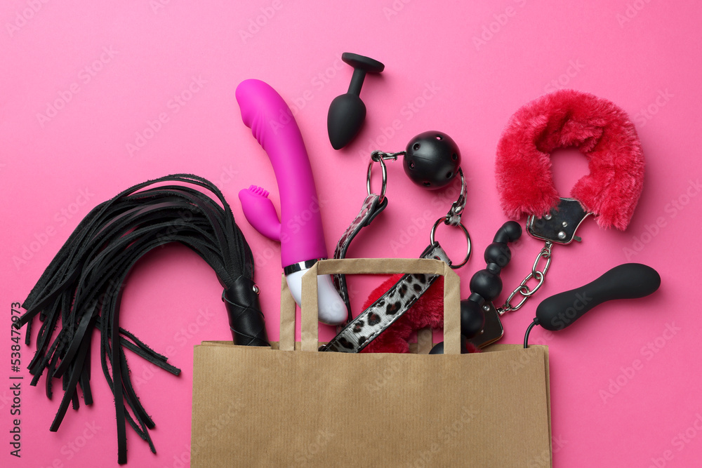 Paper shopping bag with different sex toys on pink background, flat lay Stock Photo | Adobe Stock Paper shopping bag with different sex toys on pink background, flat lay Stock Photo | Adobe Stock