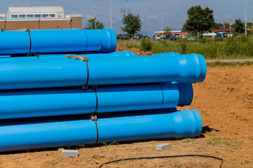 Wall Mural - On construction site for new house, blue plastic PVS pipes were introduced to drainage of septic system to home