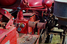 Driver's Seat View Of Gauges And Controls On Vintage Red  Farm Tractor