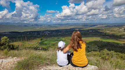 Wall Mural - mother and son admiring countryside france landscape ( cevennes mountain background)