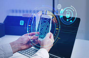 Poster - Businessman with smartphone and laptop, fingerprint hologram on screen