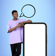 Poster - African man hand point at phone, empty speech bubble and big mockup screen