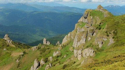 Wall Mural - Footage of a beautiful mountainous landscape with lush green nature and vegetation