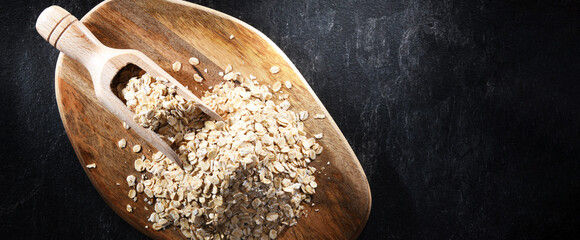 Poster - Rolled oats on the wooden cutting board