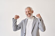 Happy excited rich successful old senior professional business man leader investor winner raising fists isolated on white background celebrating success victory, rejoicing work achievements.