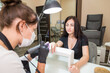 © Tania - Manicurist makes a manicure to a client girl in a beauty salon.