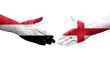 © prehistorik - Handshake between England and Yemen flags painted on hands, isolated transparent image.