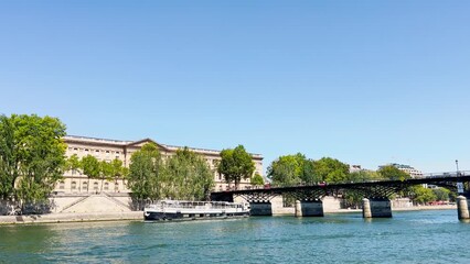 Wall Mural - Pont des Arts bridge in Paris from boat on Seine river, France