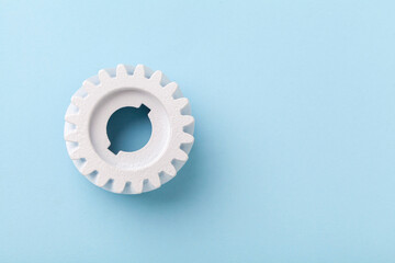 White gears wheels flat lay symbolizing idea, cooperation or teamwork, work and connection concept