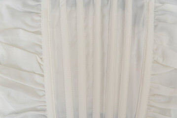 Wall Mural - Texture of white cotton fabric. Part of satin clothes corset. Natural textile cream milky color.