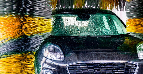 A vehicle in an automatic car wash