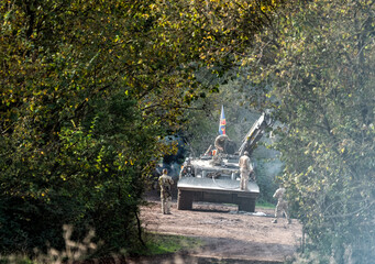 Wall Mural - British army Challenger CRARRV tank recovery vehicle with crane arm extended and reme soldiers preparing for action