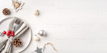 Christmas Place Setting On White Wooden Table. Copy Space For Text.