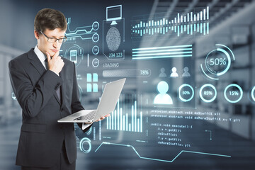 Poster - businessman using laptop with creative glowing business chart interface hologram on blurry office interior background. Company digital data, guide and computer analysis concept. Double exposure.