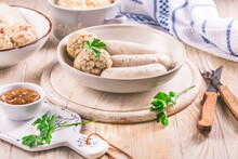 White Veal Sausage (Weisswurst) With Pickled White Sour Cabbage (Sauerkraut) And Bread Dumplings (Knodel)