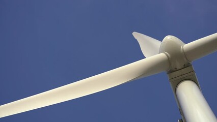 Wall Mural - Wind Turbine Energy Generator With Large White Propeller Rotating